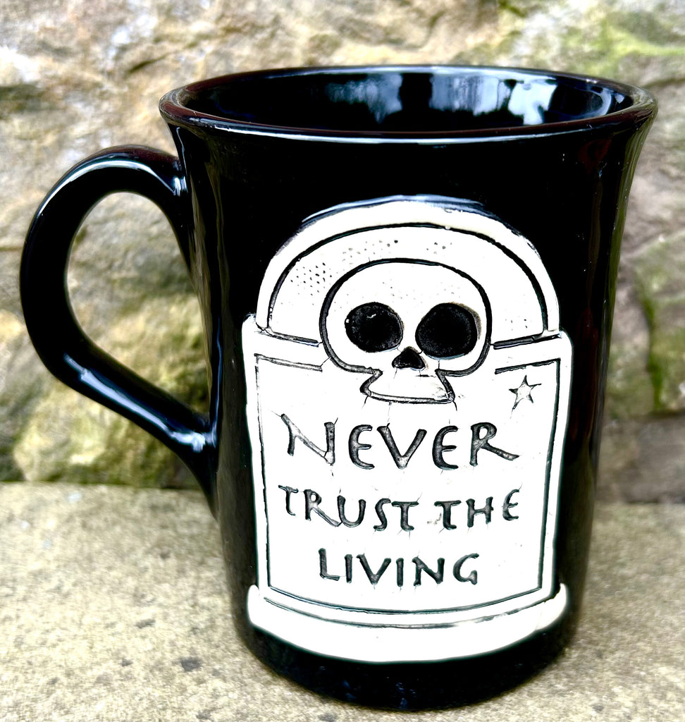 “Never Trust the Living” mug