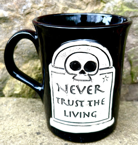 “Never Trust the Living” mug